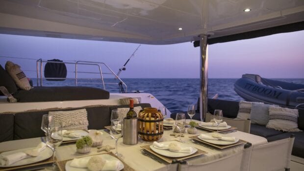 boom lagoon catamaran dining (2) min - Valef Yachts Chartering